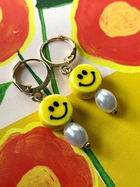 Goldtone hoop earrings w/ ceramic smily face beads & faux pearl drops rave